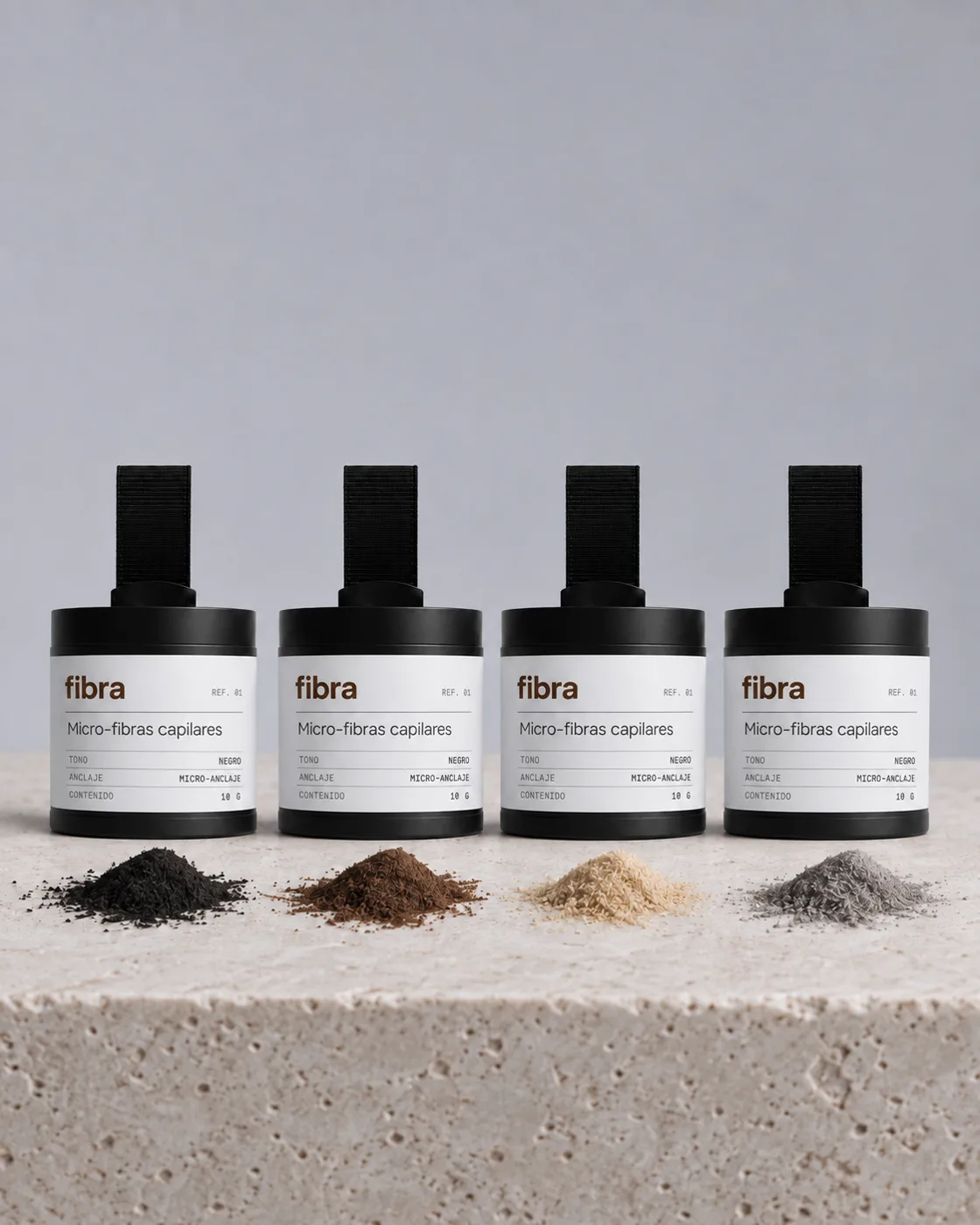 Cuatro frascos de fibra con micro-fibras en tonos negro, castaño, rubio y gris